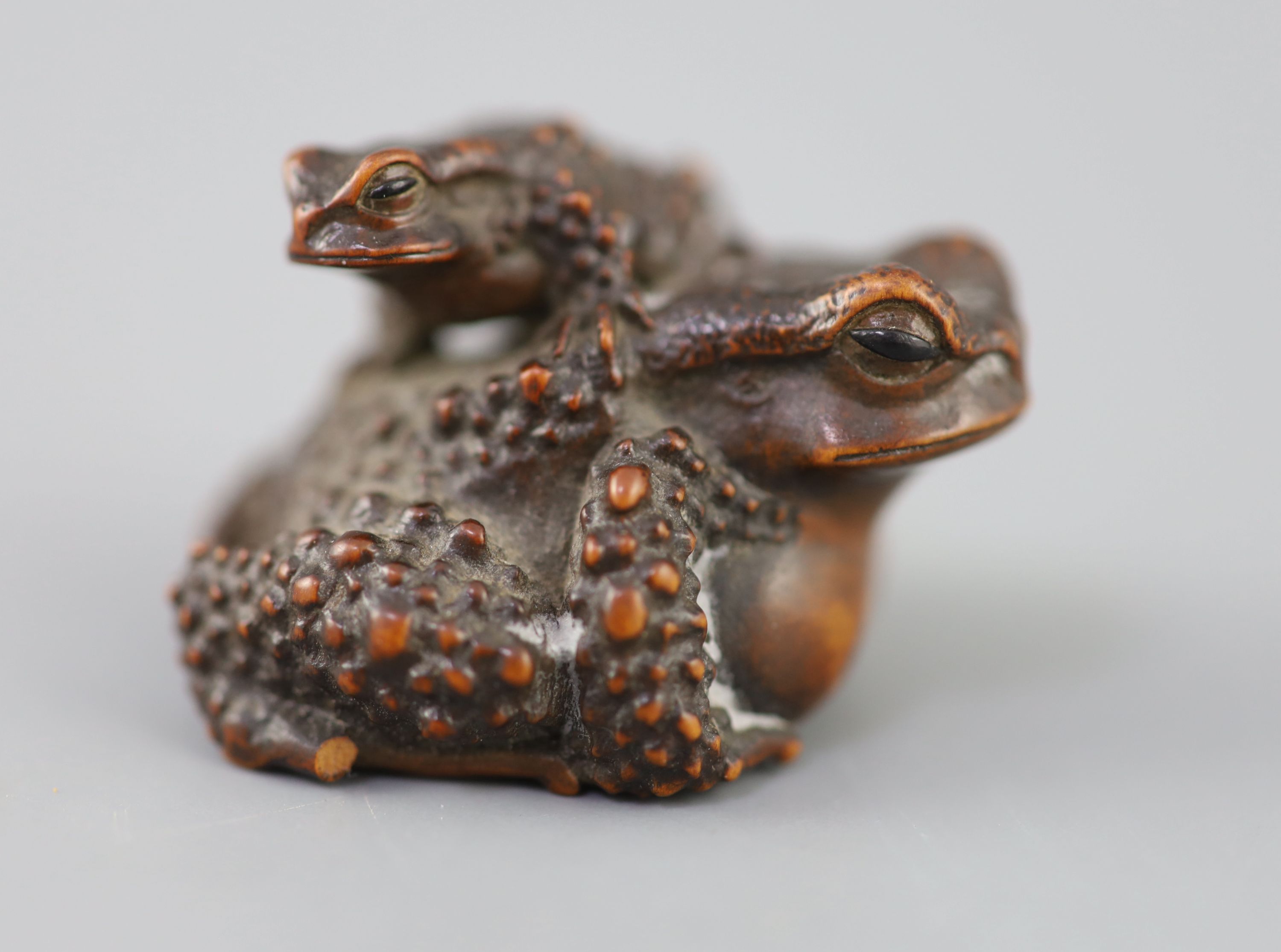 A fine Japanese wood okimono of toads, signed Masanao, 19th century,